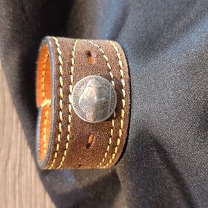 Upcycled leather cuff bracelet made from a leather belt.